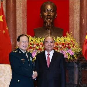 Has Vietnam President Nguyen Xuan Phuc pledged not to partner with another country against China?